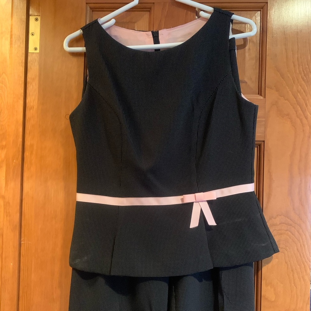 Versatile black and pink polka dot pantsuit.